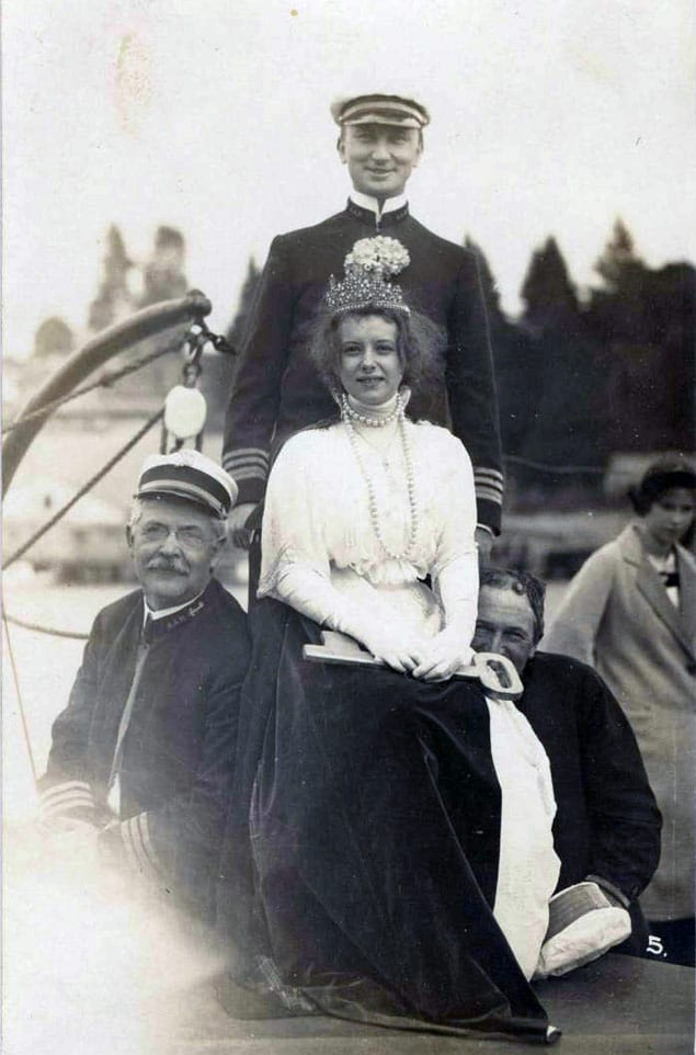 Unidentified Cathlamet Regatta queen and others, 1913. Another Woodfield photo taken at the same time (held by the Wahkiakum County Historical Society) is captioned: Cathlamet Regatta Queen and Admiral, 1913. Aboard flagship. #17, Woodfield Photo. Courtesy Cathlamet Blanche Bradley Public Library